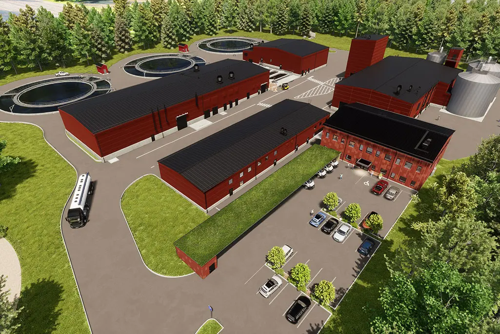 Illustration över hur reningsverket i Vappa skulle kunna se ut. Illustrationen visar flera röda byggnader med svart tak. Det syns även bassänger och silos. En liten parkering syns också.